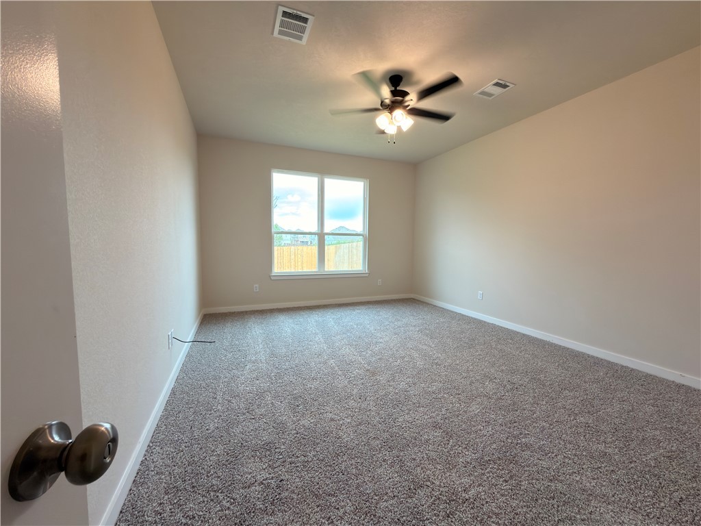 1394 Kingsgate Drive Bryan, TX 77807 - Photo 7 of 10 a view of an empty room with a window