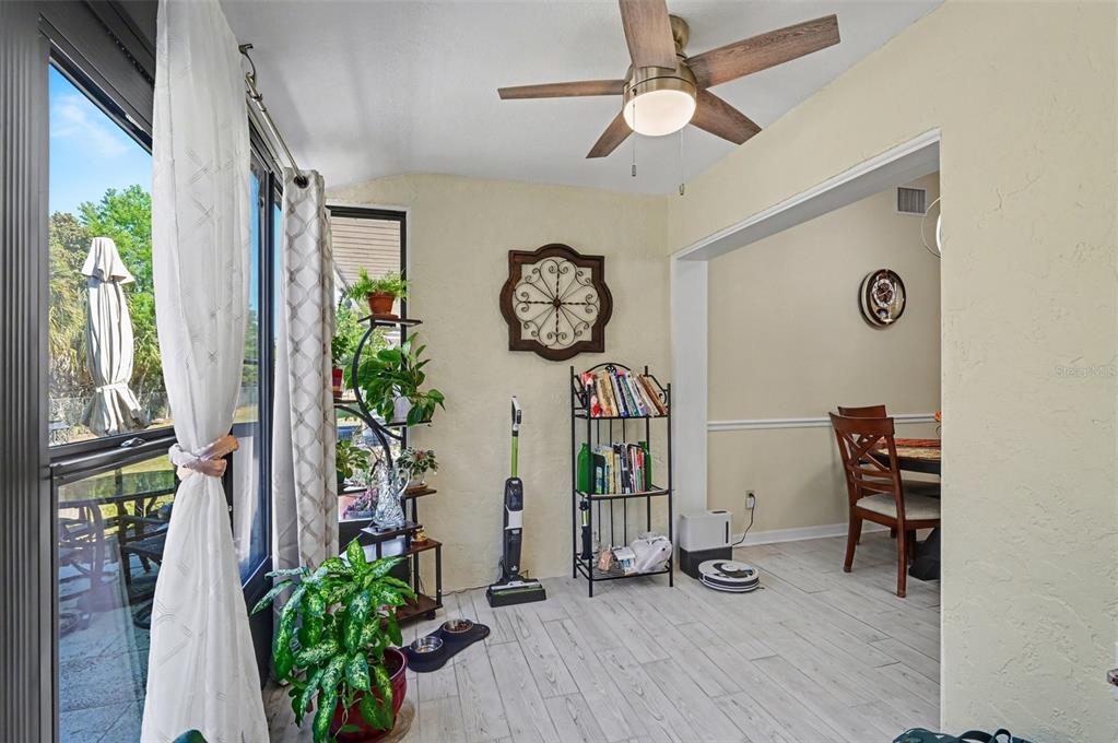 12435 Orangewood Circle Tavares, FL 32778 - Photo 16 of 30 a view of entryway with wooden floor
