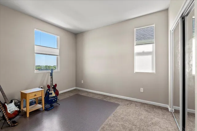 a room with a window and wooden floor