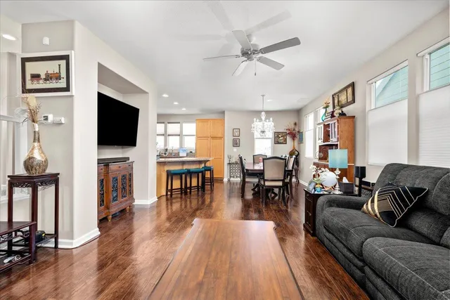 a living room with fireplace furniture and a flat screen tv