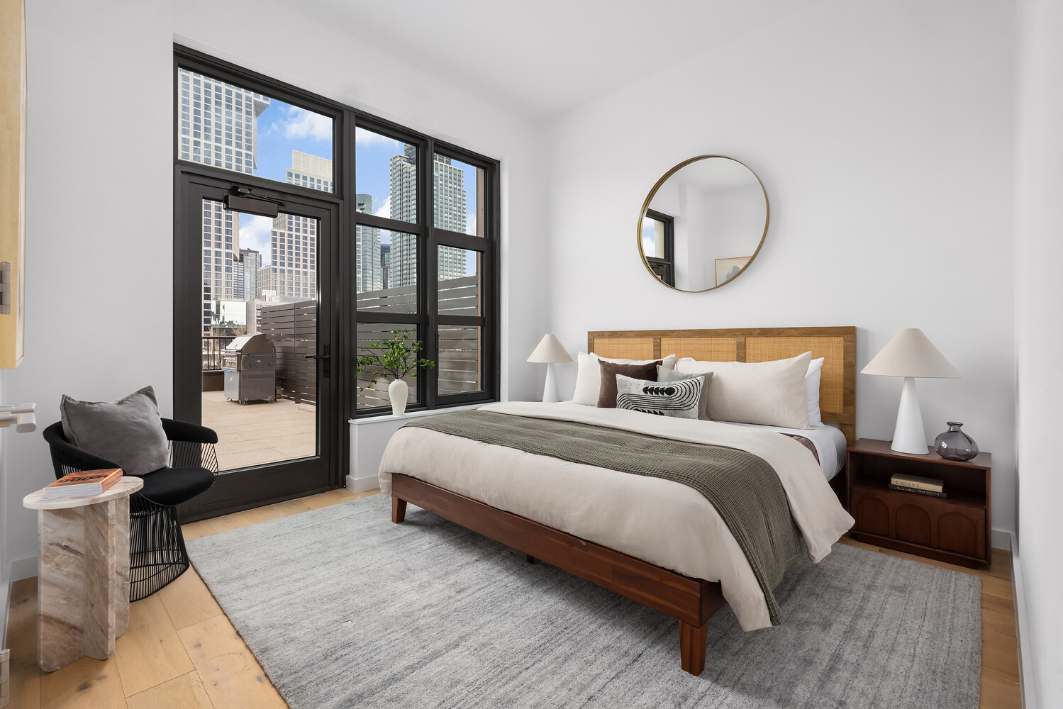 29 Huron Street, Unit 2AW Brooklyn, NY 11222 - Photo 4 of 17 a bedroom with bed and a large window