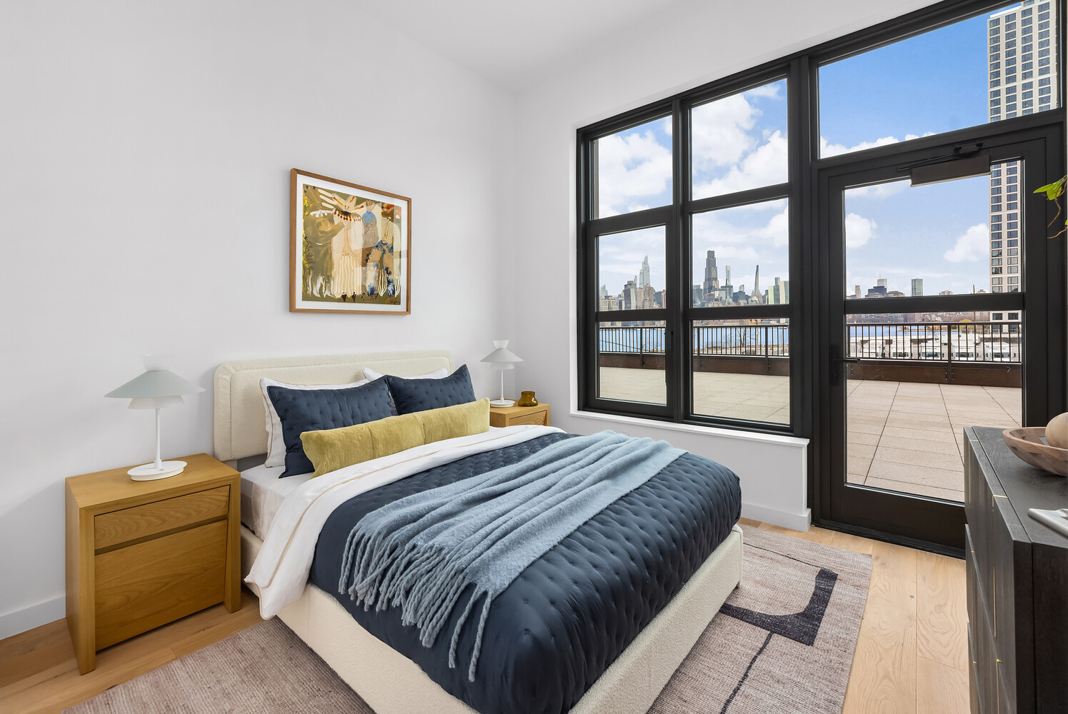 29 Huron Street, Unit 2AW Brooklyn, NY 11222 - Photo 6 of 17 a bedroom with a bed and a large window
