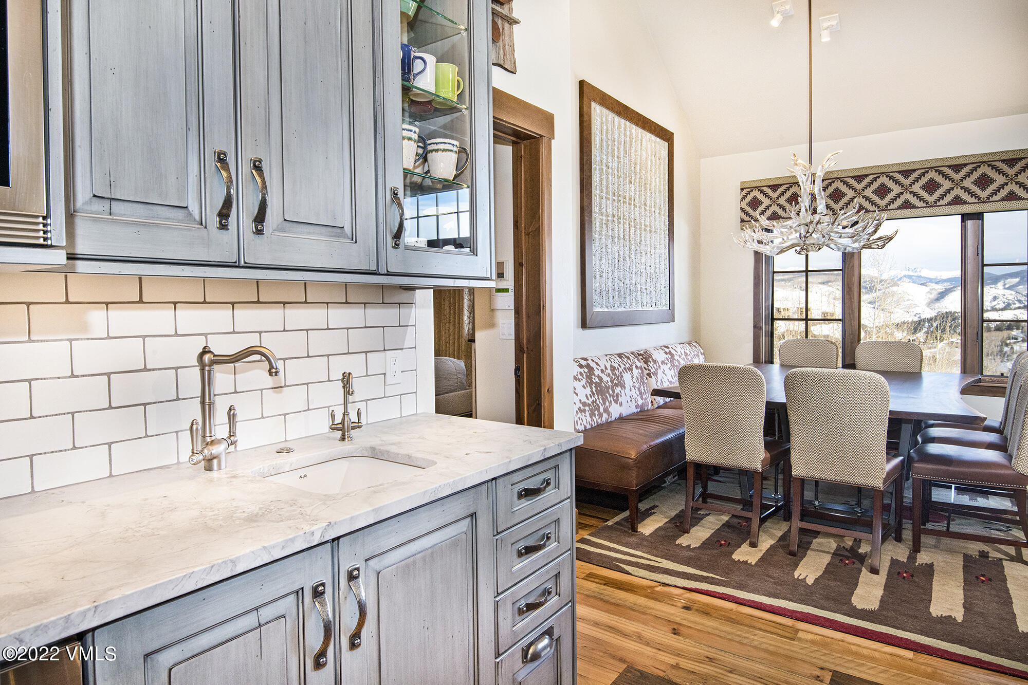 1250 Bachelor Ridge Road Avon, CO 81620 - Photo 12 of 60 a view of a kitchen area with furniture and windows