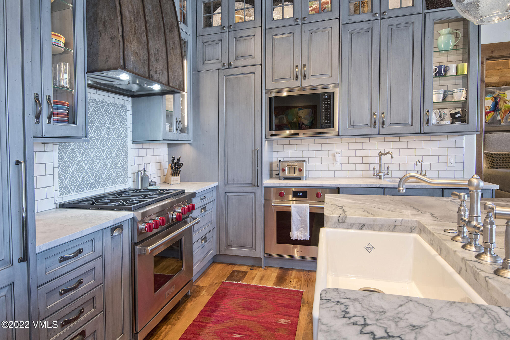 1250 Bachelor Ridge Road Avon, CO 81620 - Photo 13 of 60 a kitchen with stainless steel appliances granite countertop a stove and a sink