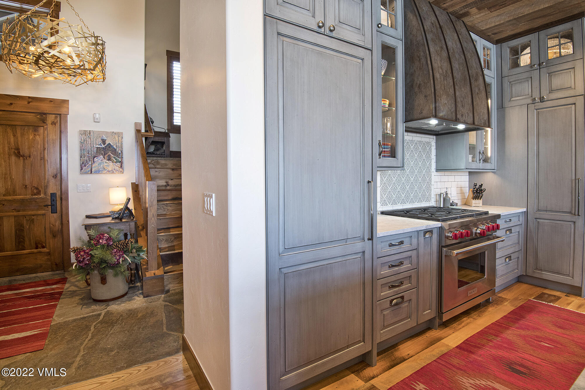 1250 Bachelor Ridge Road Avon, CO 81620 - Photo 14 of 60 a kitchen with stainless steel appliances granite countertop a refrigerator and a stove