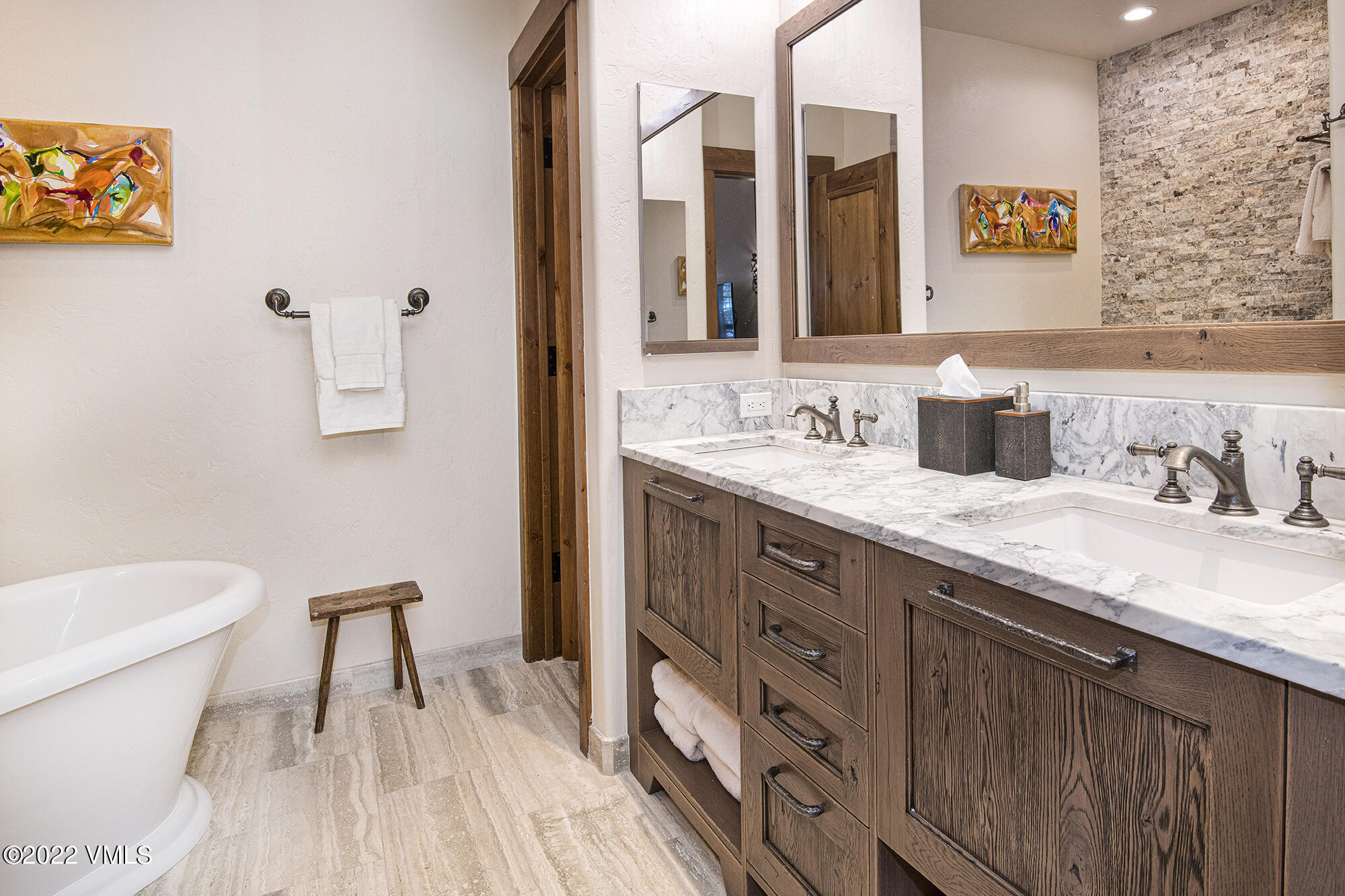 1250 Bachelor Ridge Road Avon, CO 81620 - Photo 17 of 60 a bathroom with a granite countertop sink a toilet and a mirror