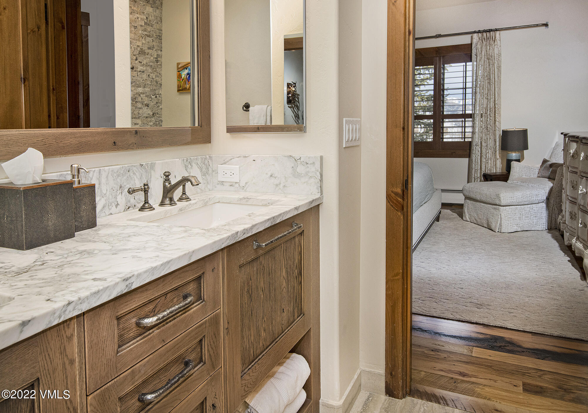 1250 Bachelor Ridge Road Avon, CO 81620 - Photo 21 of 60 a en suite bathroom with a granite countertop sink and a mirror