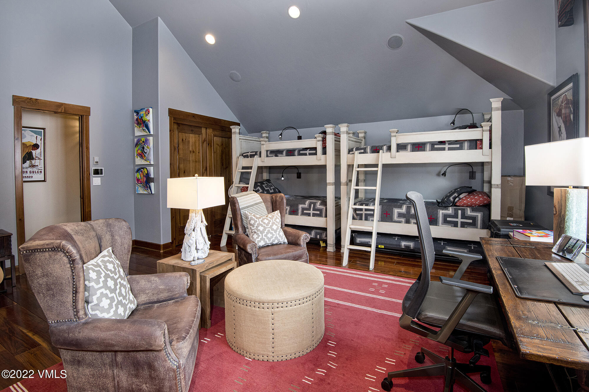 1250 Bachelor Ridge Road Avon, CO 81620 - Photo 26 of 60 a work room with furniture a flat screen tv and a floor to ceiling window