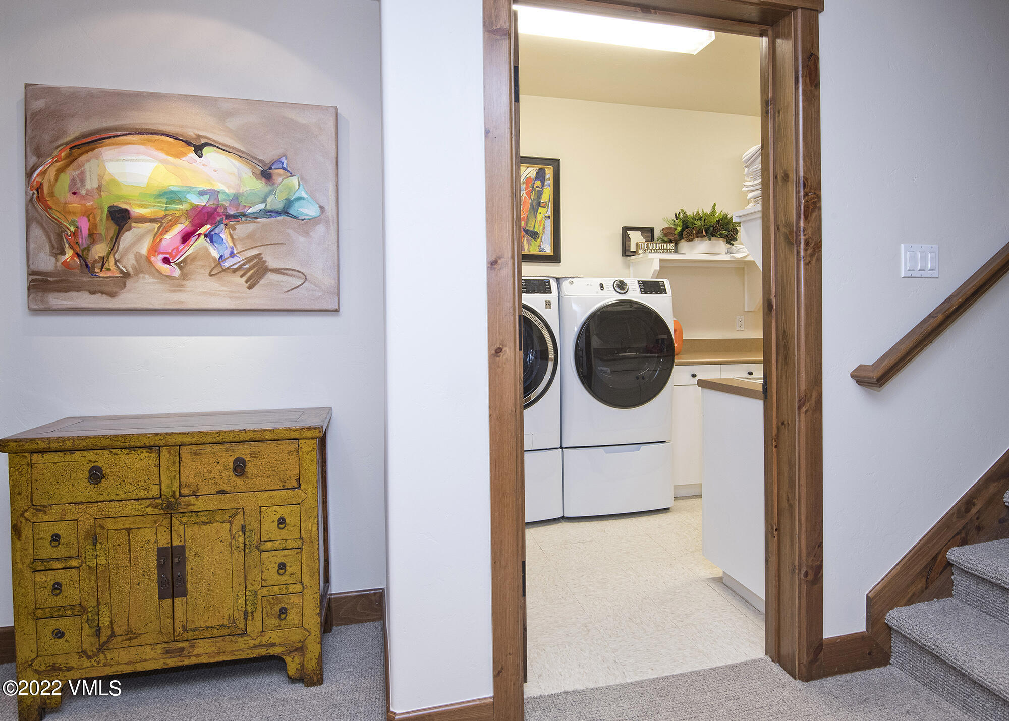1250 Bachelor Ridge Road Avon, CO 81620 - Photo 28 of 60 a view of a hallway with entryway wooden floor and cabinet