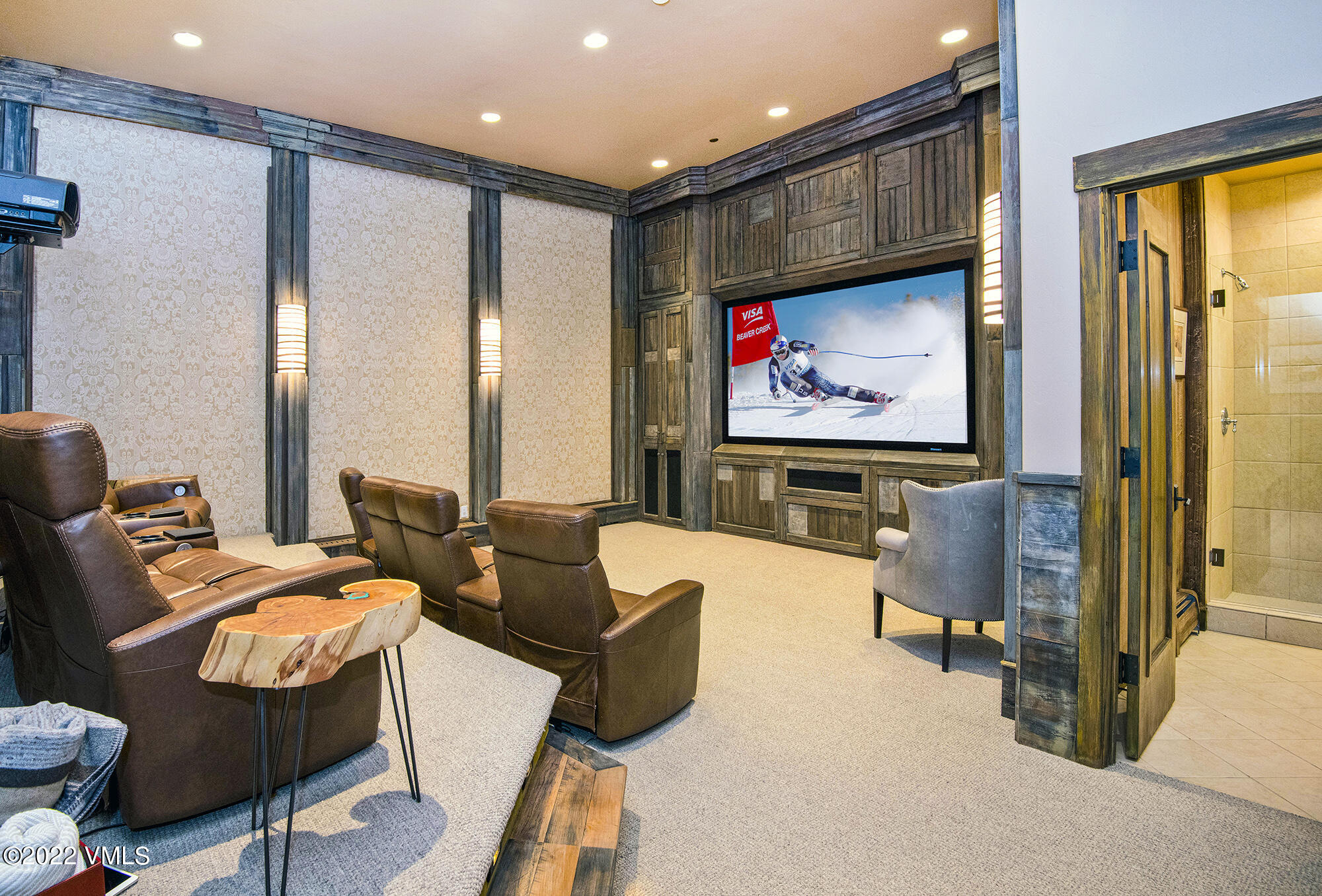 1250 Bachelor Ridge Road Avon, CO 81620 - Photo 39 of 60 a living room with furniture a large window and a flat screen tv
