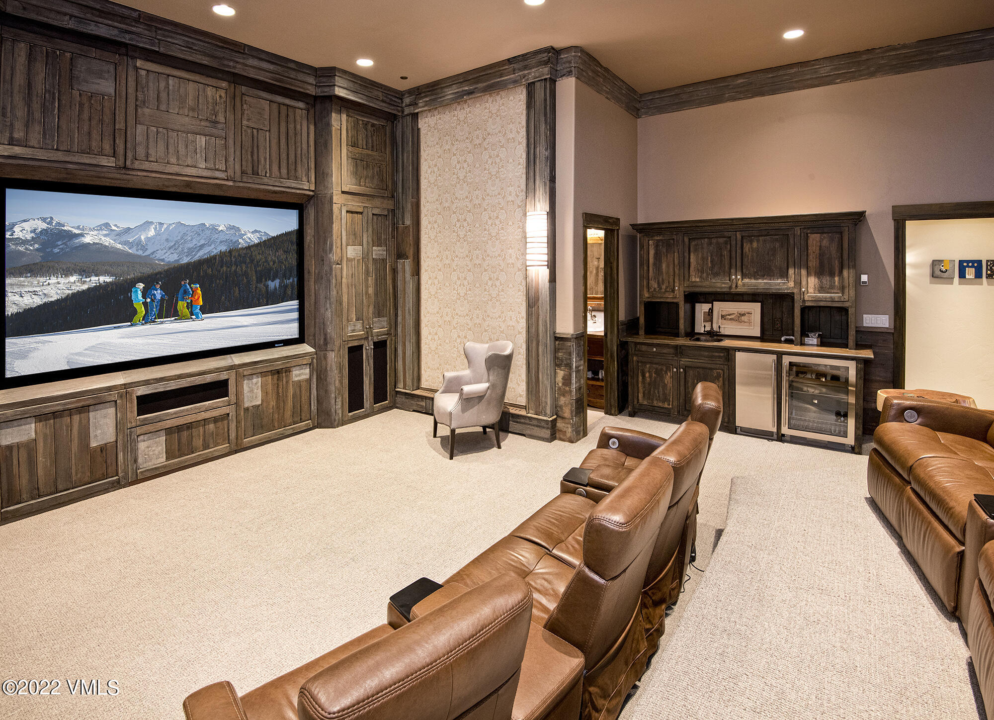 1250 Bachelor Ridge Road Avon, CO 81620 - Photo 40 of 60 a living room with furniture a flat screen tv and kitchen view
