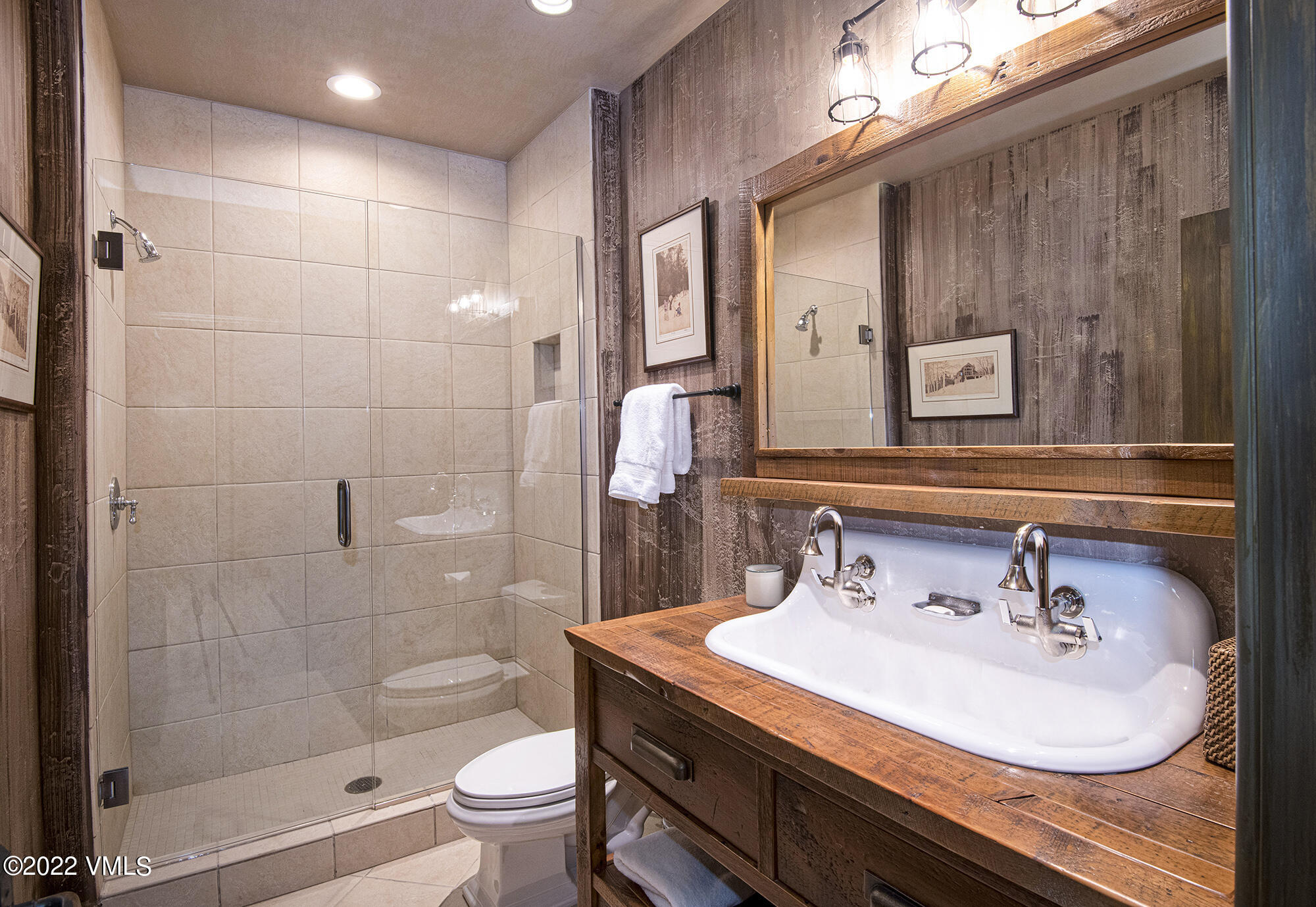 1250 Bachelor Ridge Road Avon, CO 81620 - Photo 42 of 60 a bathroom with a sink and a mirror
