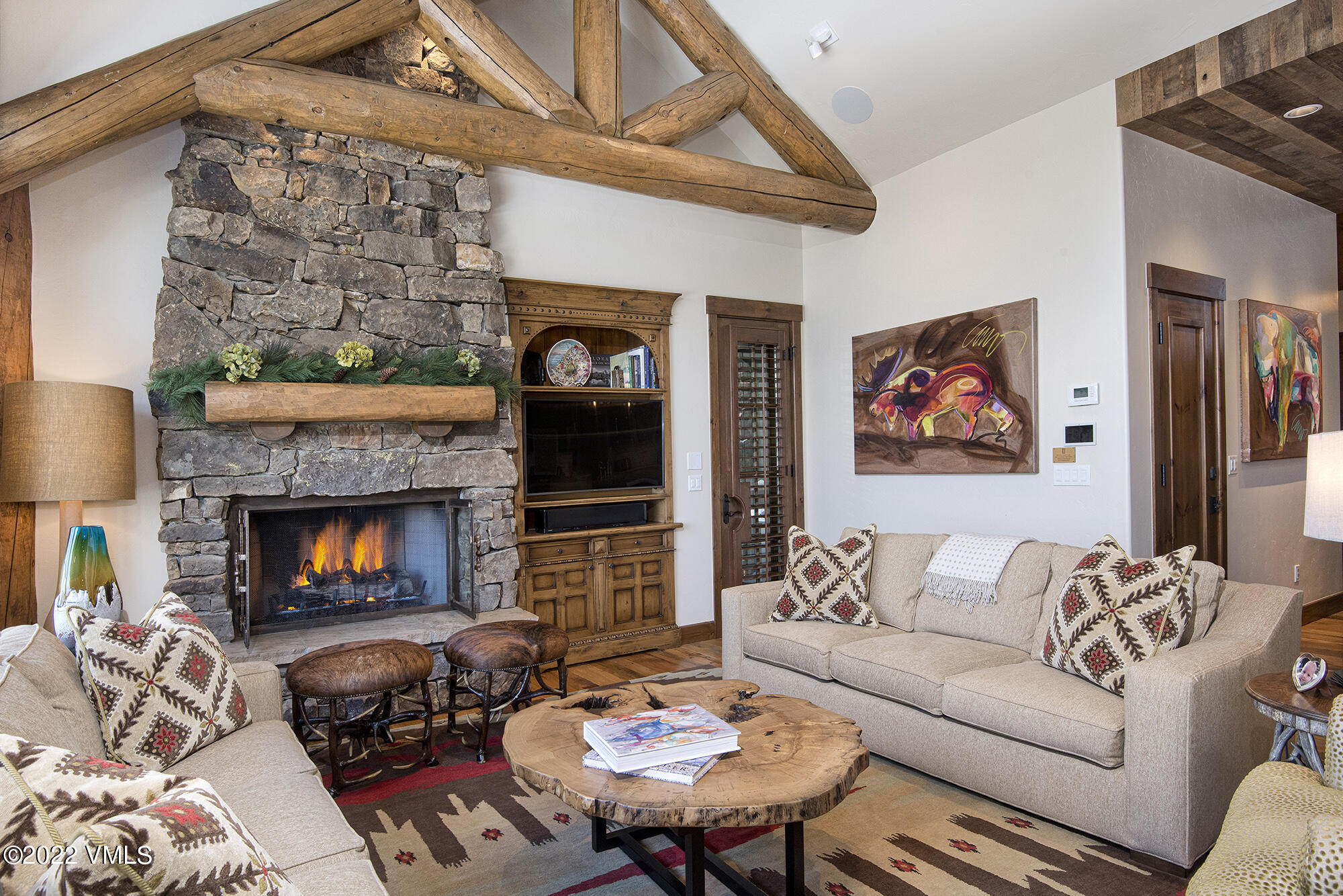 1250 Bachelor Ridge Road Avon, CO 81620 - Photo 6 of 60 a living room with furniture and a fireplace