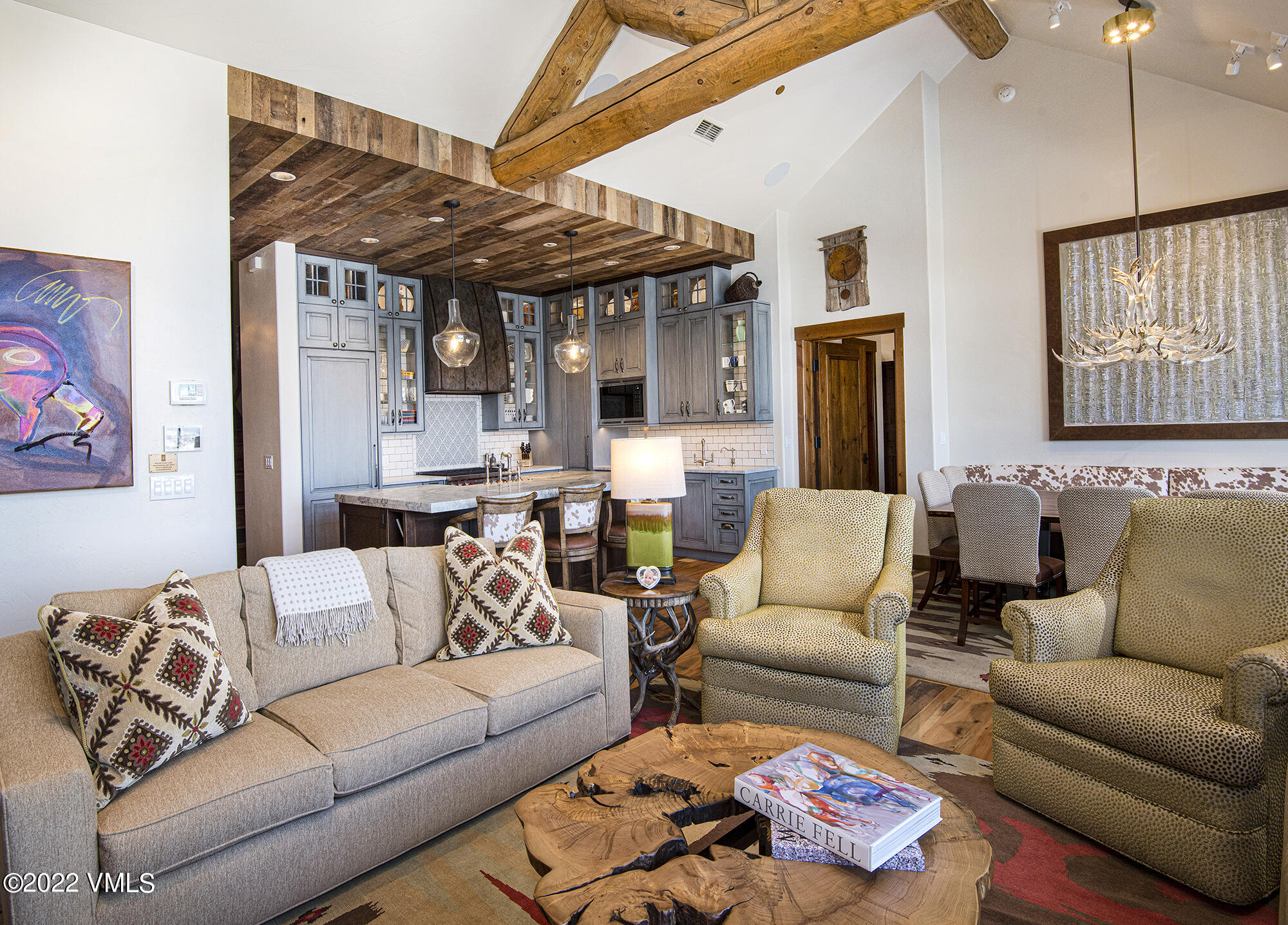 1250 Bachelor Ridge Road Avon, CO 81620 - Photo 8 of 60 a living room with furniture kitchen view and a chandelier