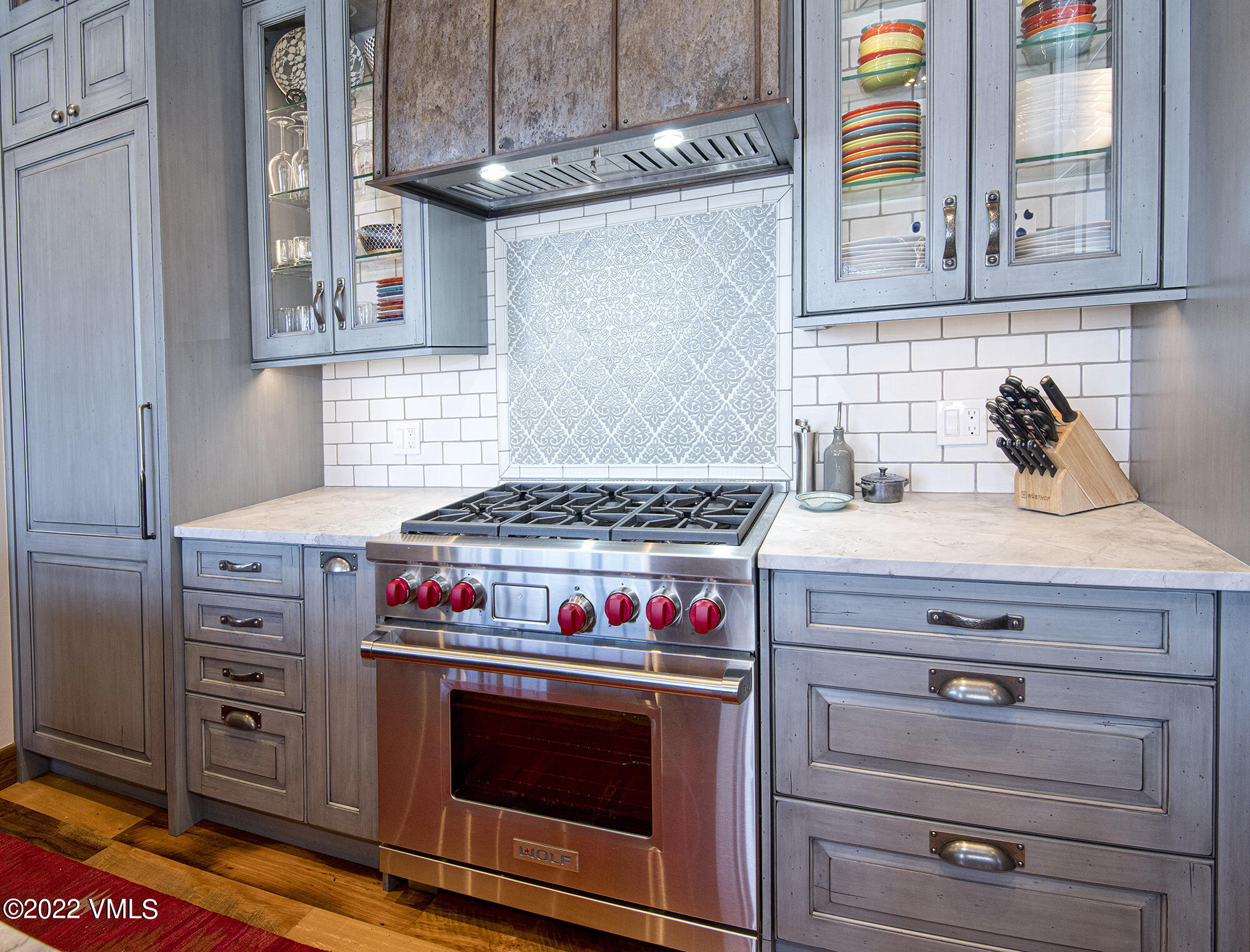 1250 Bachelor Ridge Road Avon, CO 81620 - Photo 10 of 60 a kitchen with stainless steel appliances granite countertop a stove and a microwave