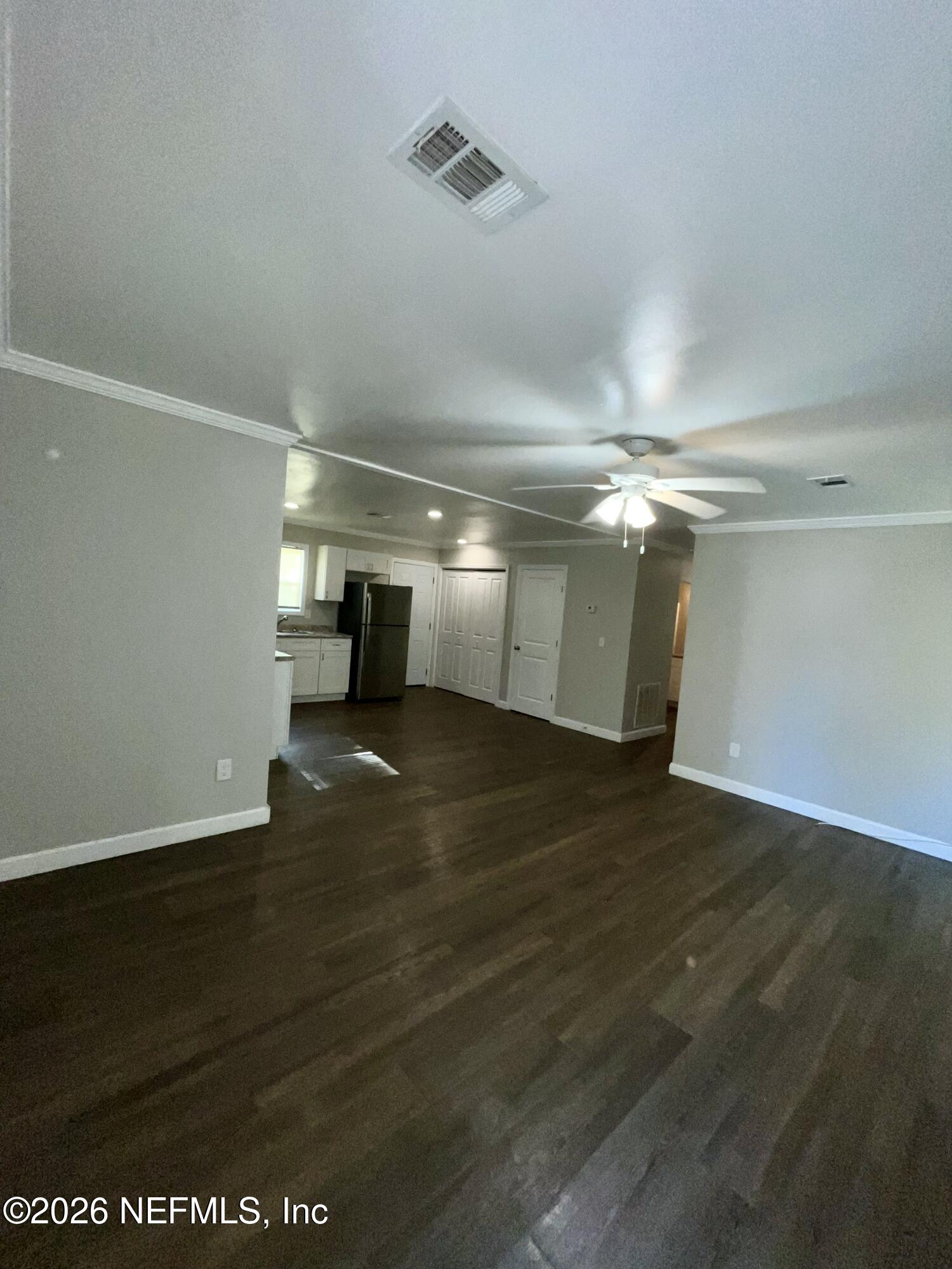 2017 Talladega Road Jacksonville, FL 32209 - Photo 14 of 34 a view of empty room with wooden floor