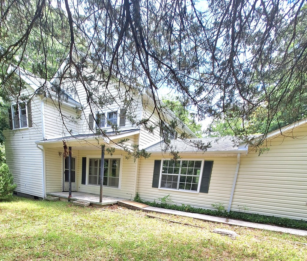 333 Lickskillet Road Epworth, GA 30541 - Photo 10 of 32 a view of a house with a yard and large tree