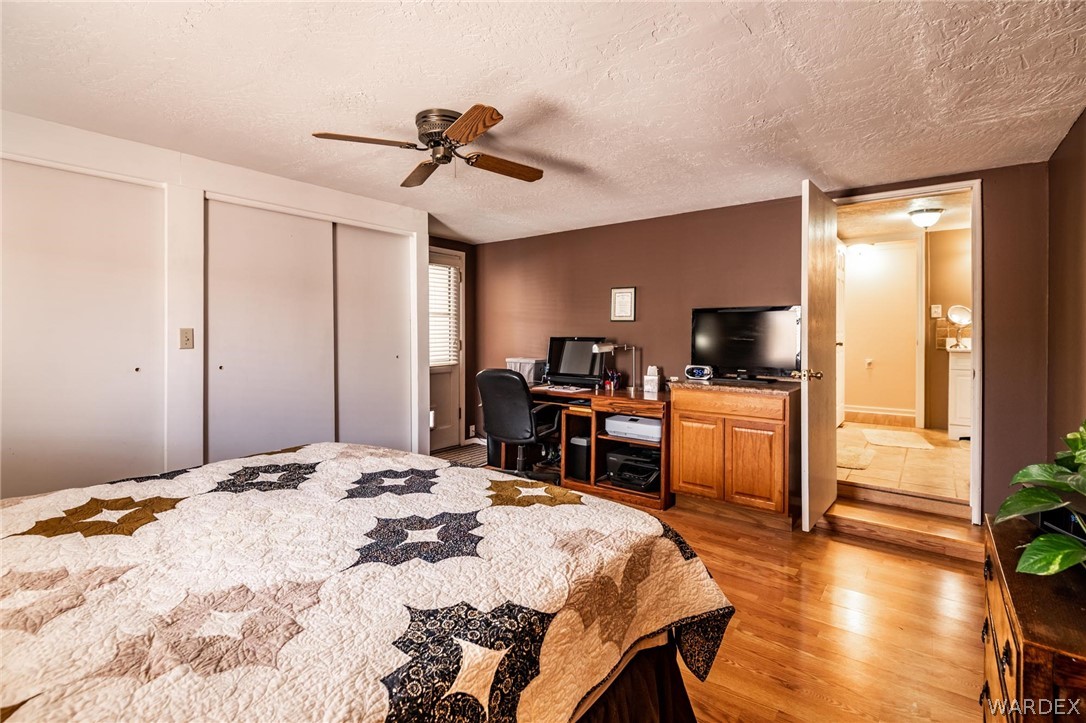 3341 Marana Road Golden Valley, AZ 86413 - Photo 25 of 46 a bed room with a bed and television