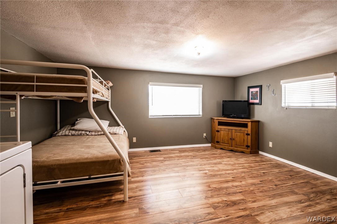 3341 Marana Road Golden Valley, AZ 86413 - Photo 29 of 46 a room with furniture and flat screen tv