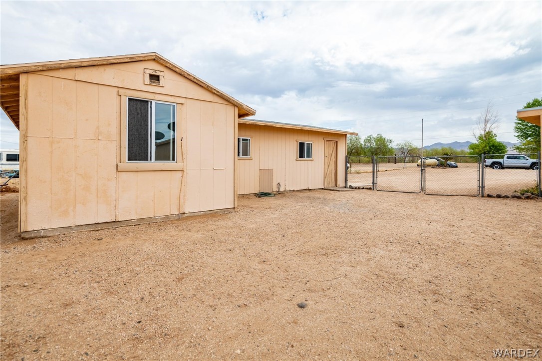 3341 Marana Road Golden Valley, AZ 86413 - Photo 46 of 46 a view of a house with a big yard