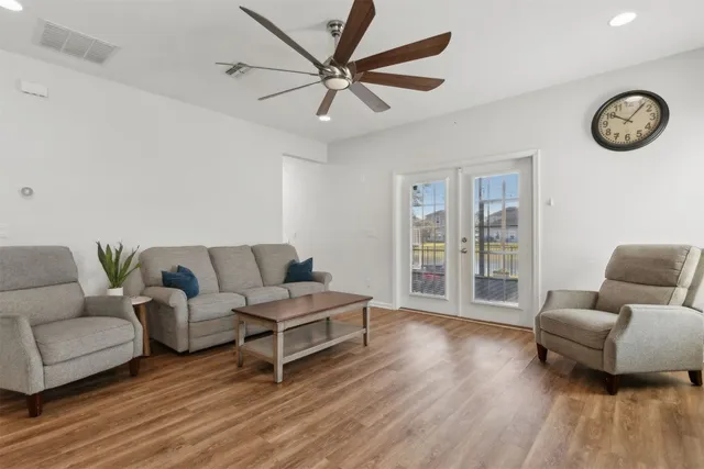 a bedroom with a bed couch and window