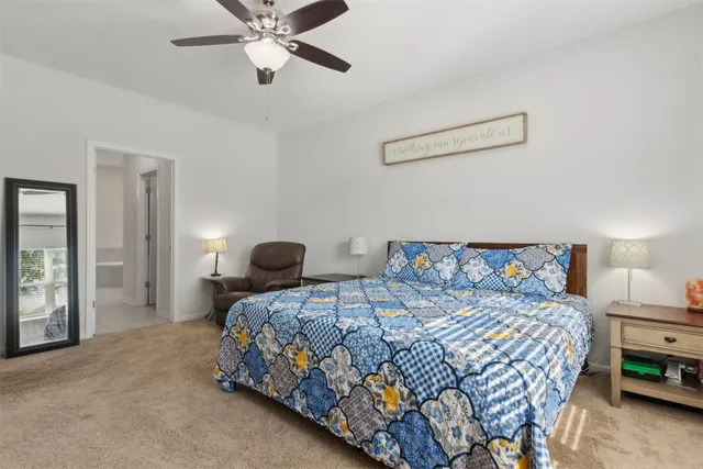 a bedroom with furniture and flat screen tv