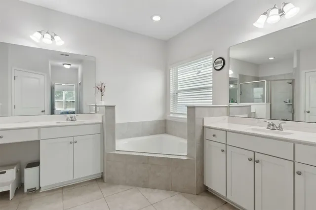 a bathroom with a sink toilet a mirror and shower