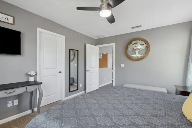 a bedroom with furniture and a dresser