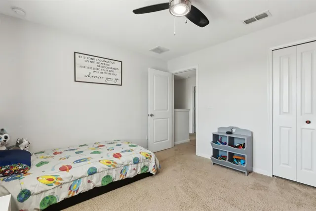 a view of a livingroom with furniture and a flat screen tv