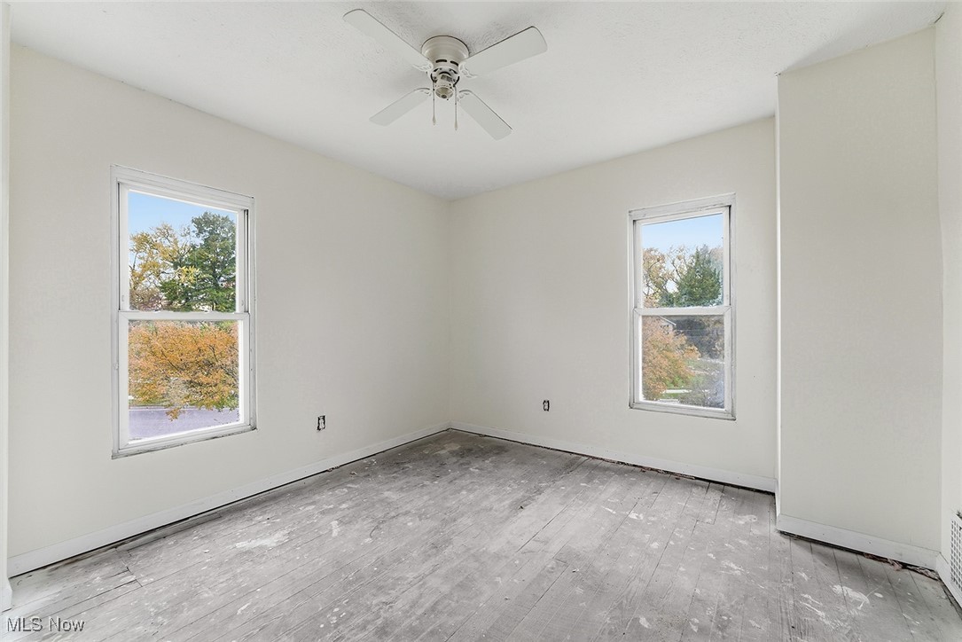 1206 Diagonal Road Akron, OH 44320 - Photo 21 of 28 Unfurnished room with a ceiling fan and baseboards