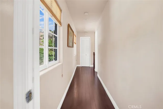 a view of a hallway with windows