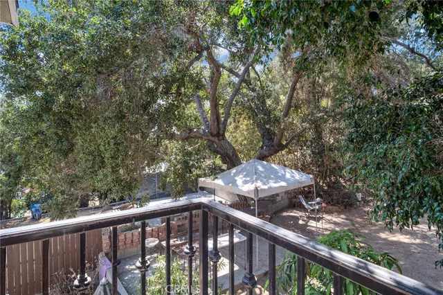 a view of a balcony with a pot