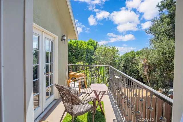 a view of balcony with furniture