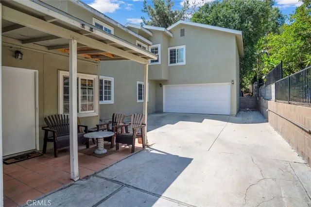 a view of house with patio