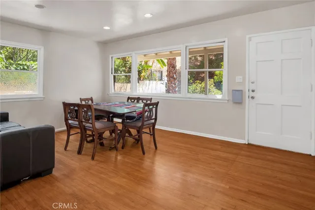 a view of a dining room with furniture and windows