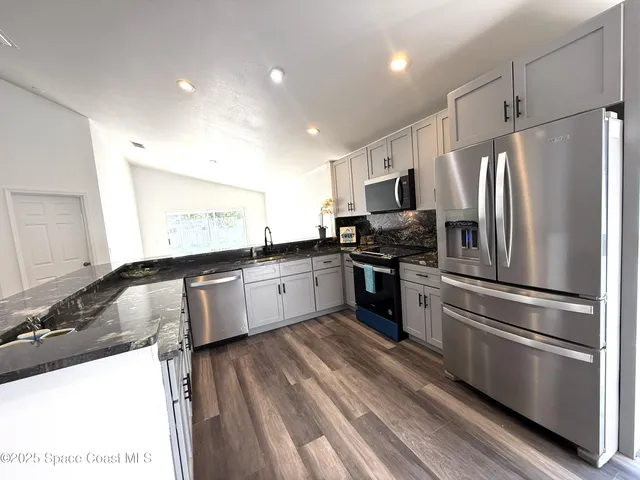 a bathroom with a toilet and a bathtub