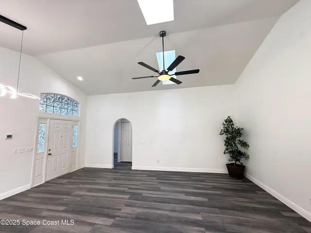 a kitchen with stainless steel appliances granite countertop a sink a stove and a microwave