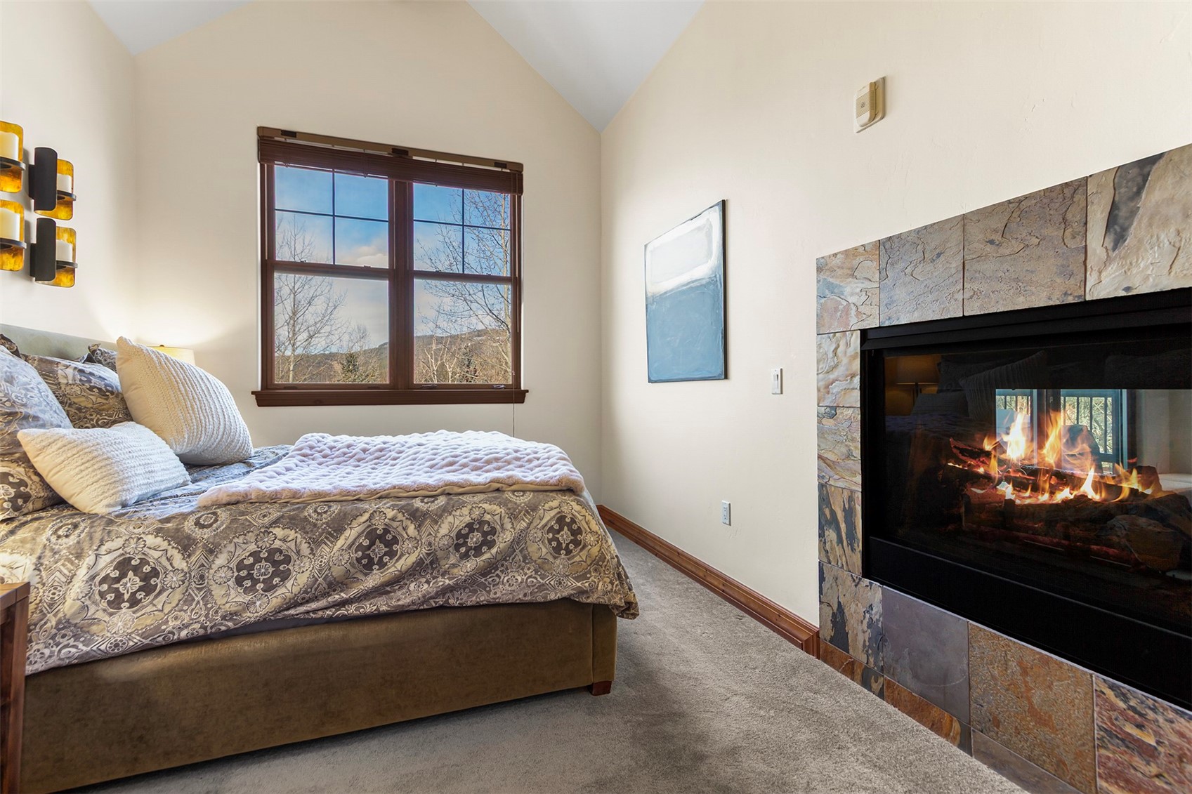 34 Highfield Trail, Unit 404 Breckenridge, CO 80424 - Photo 11 of 25 a living room with a couch and a flat screen tv