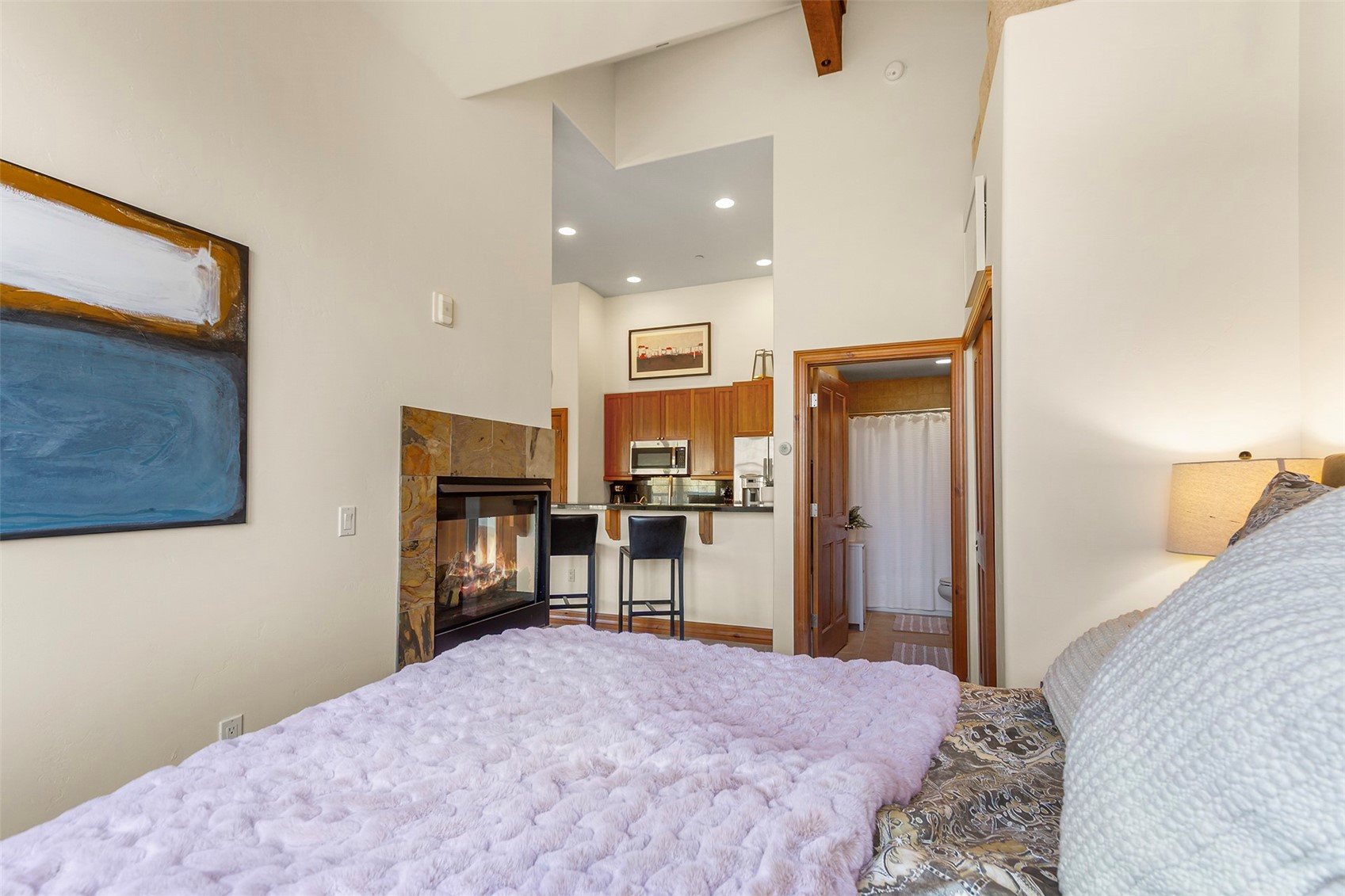 34 Highfield Trail, Unit 404 Breckenridge, CO 80424 - Photo 14 of 25 a bedroom with a bed and a television in it