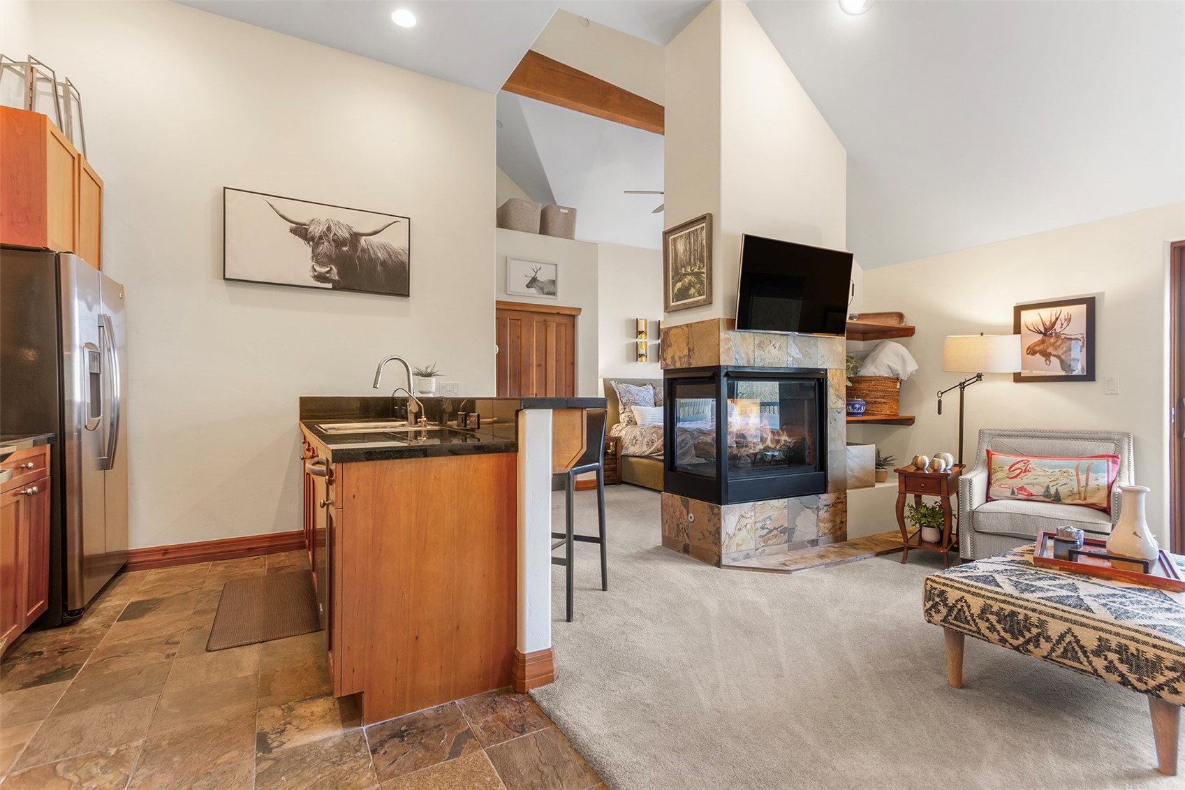 34 Highfield Trail, Unit 404 Breckenridge, CO 80424 - Photo 2 of 25 a living room with furniture and a flat screen tv