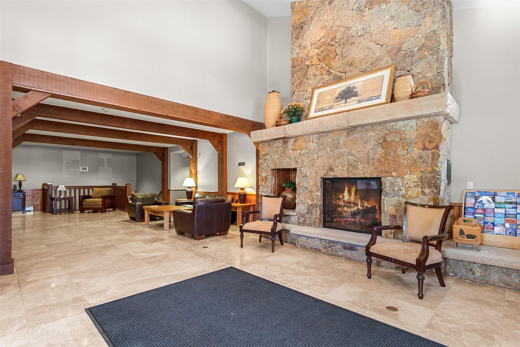 34 Highfield Trail, Unit 404 Breckenridge, CO 80424 - Photo 22 of 25 a living room with furniture and a fireplace