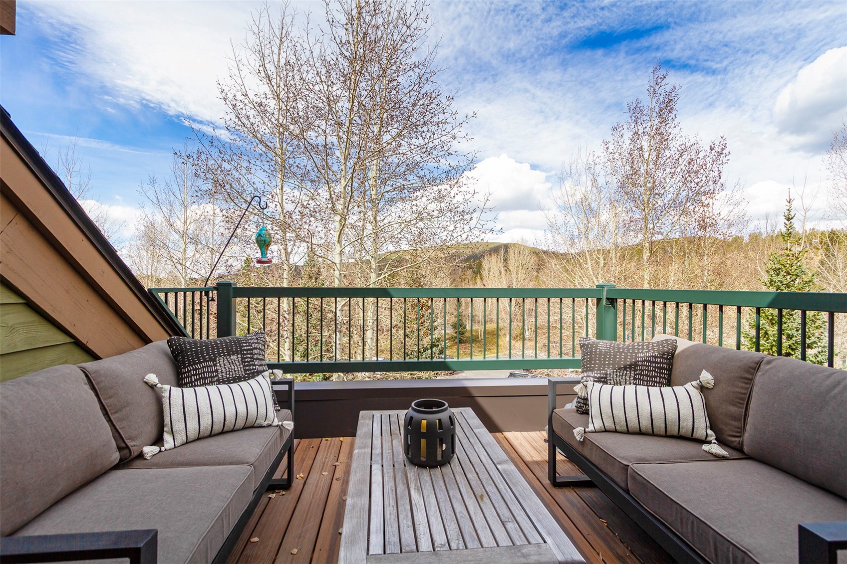 34 Highfield Trail, Unit 404 Breckenridge, CO 80424 - Photo 4 of 25 a roof deck with couches and wooden floor