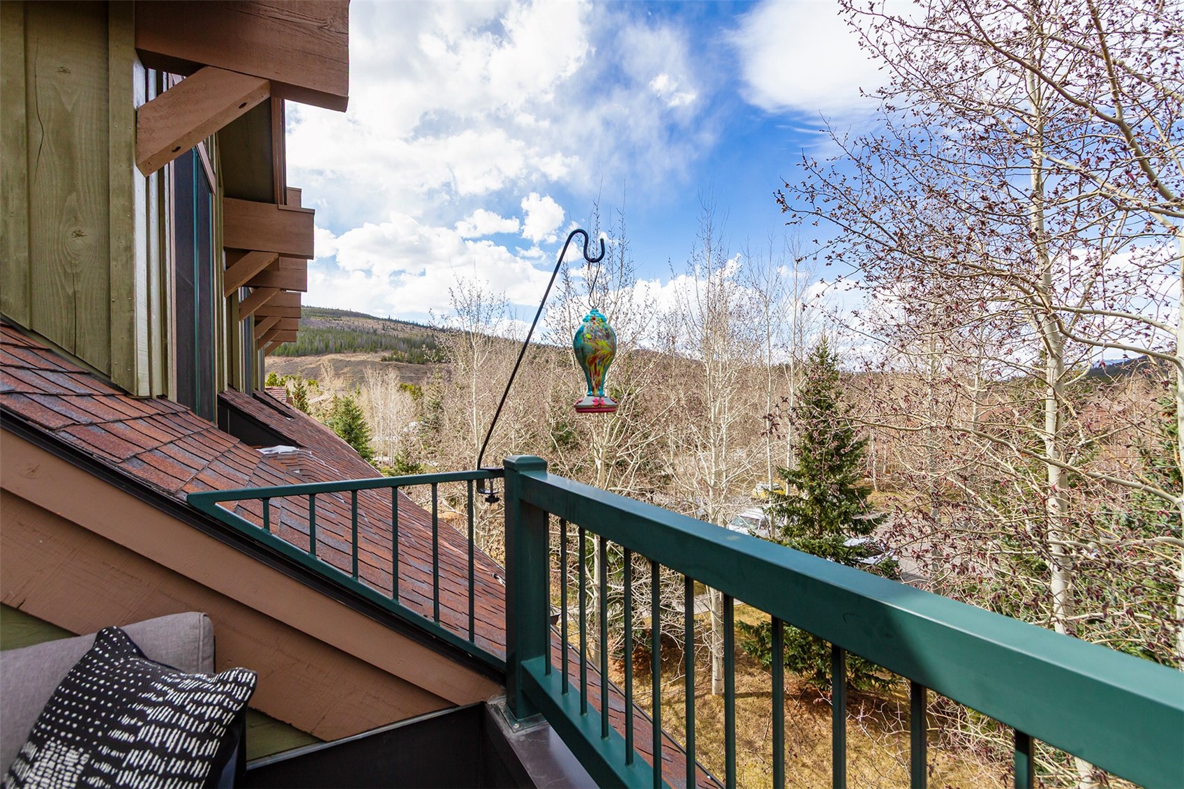34 Highfield Trail, Unit 404 Breckenridge, CO 80424 - Photo 5 of 25 a view of balcony with wooden floor and fence