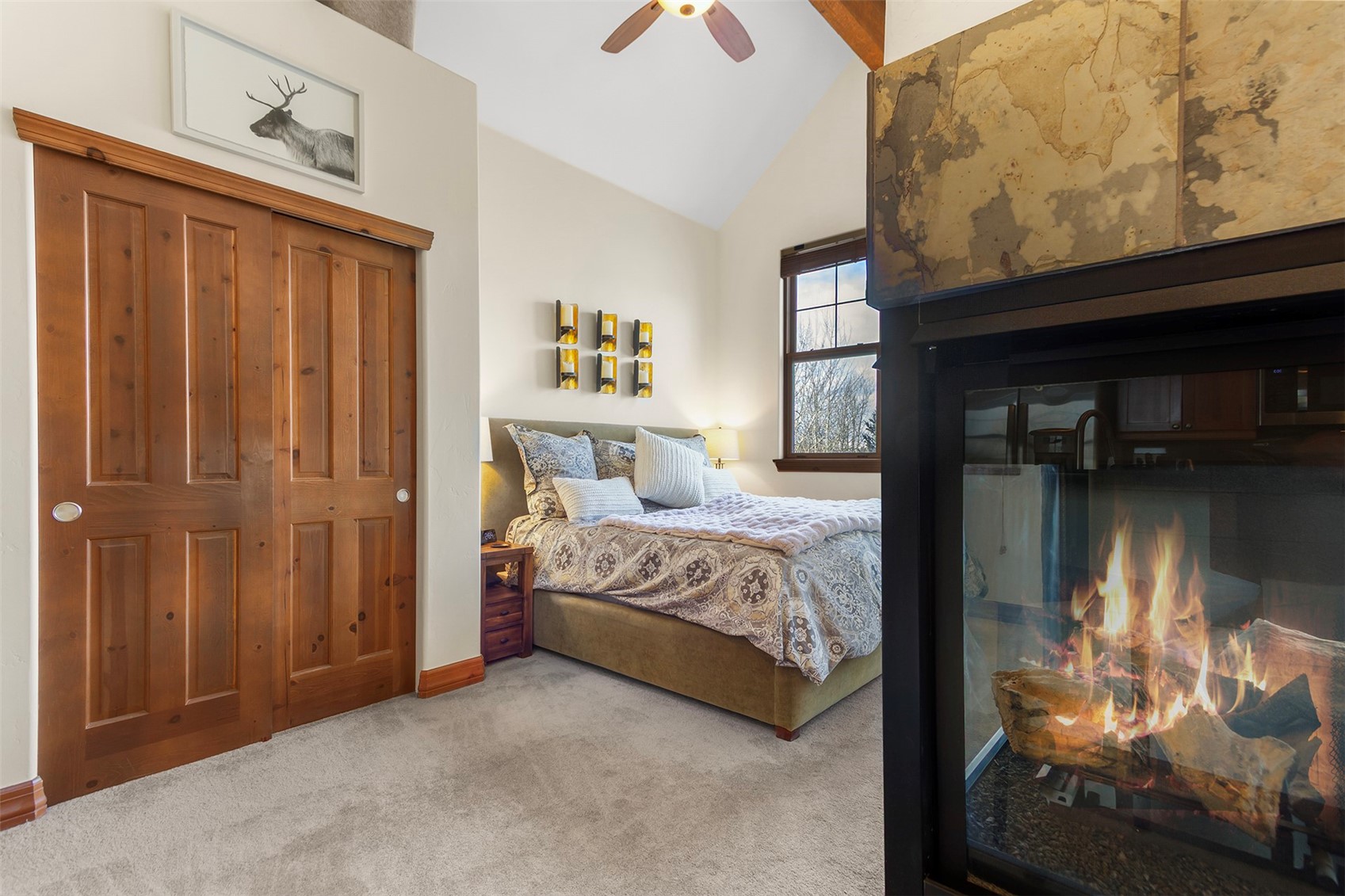 34 Highfield Trail, Unit 404 Breckenridge, CO 80424 - Photo 10 of 25 a bedroom with a bed and a tv on table