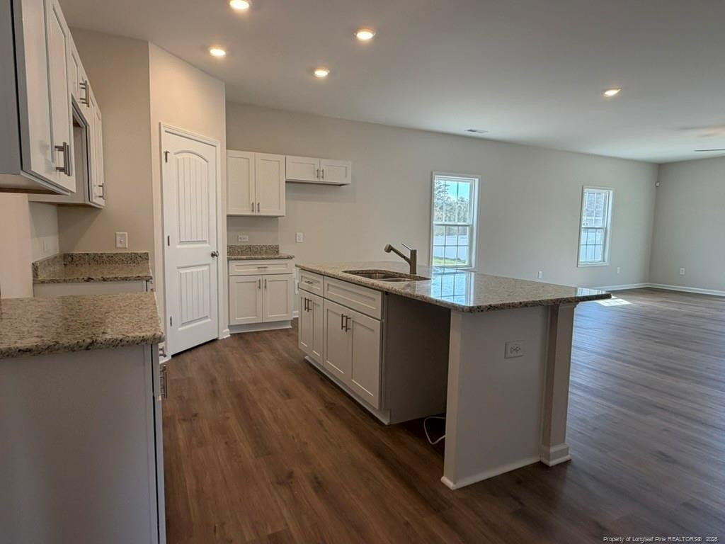 5409 Short Leaf Road Fayetteville, NC 28311 - Photo 11 of 40 a kitchen with stainless steel appliances granite countertop a stove a sink and a refrigerator