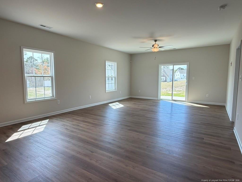 5409 Short Leaf Road Fayetteville, NC 28311 - Photo 14 of 40 a view of an empty room with wooden floor and a window