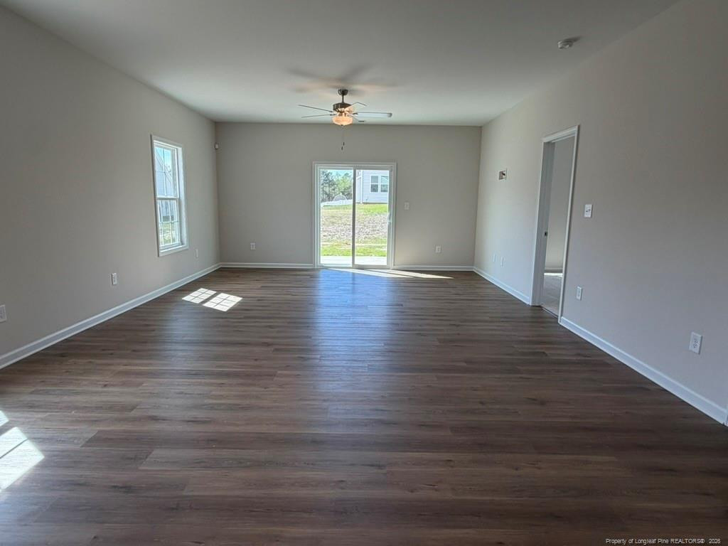 5409 Short Leaf Road Fayetteville, NC 28311 - Photo 18 of 40 an empty room with wooden floor and windows