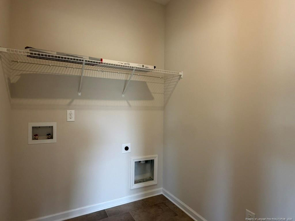 5409 Short Leaf Road Fayetteville, NC 28311 - Photo 19 of 40 an empty room with wooden floor and cabinet