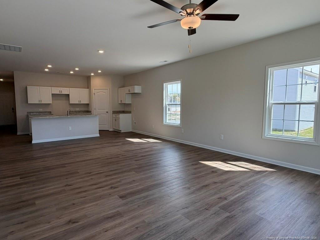 5409 Short Leaf Road Fayetteville, NC 28311 - Photo 20 of 40 an empty room with wooden floor and windows