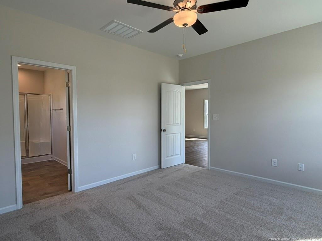 5409 Short Leaf Road Fayetteville, NC 28311 - Photo 25 of 40 a view of an empty room and chandelier fan